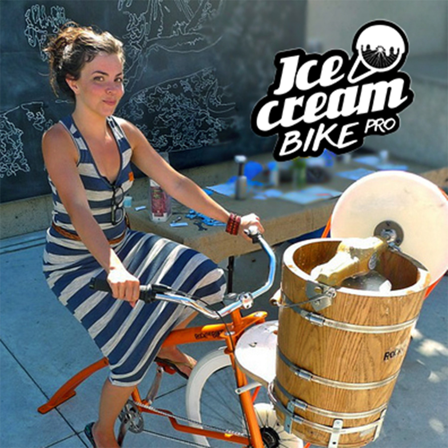 Woman pedaling a bike that churns an ice cream maker, also known as the Ice Cream Bike Pro.