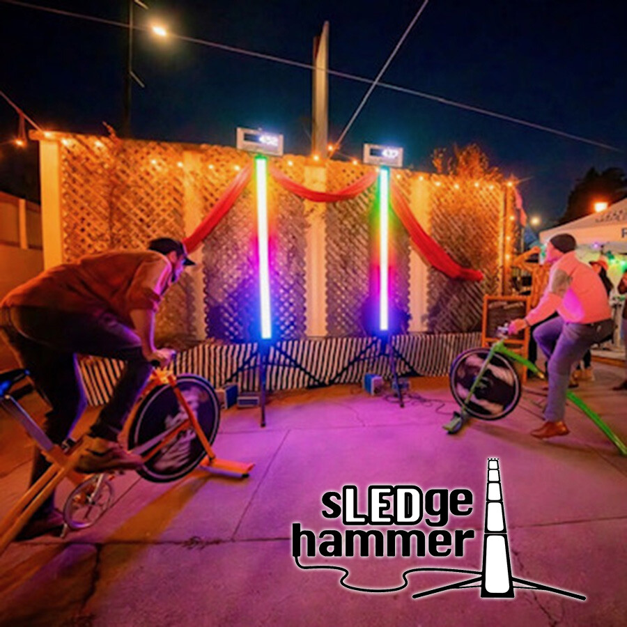 sLEDgehammer product being pedaled by two friends making a vertical light gauge fill up.